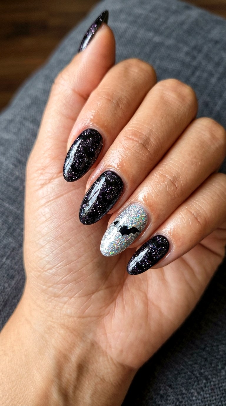 Glittery Bat Accent Nails - 23 simple halloween nail design ideas