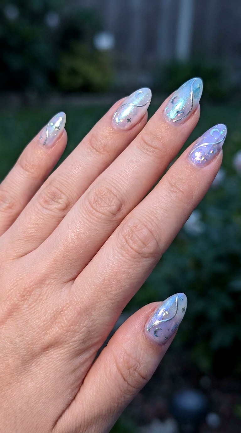 Iridescent Moonlit Swirls - 25 magical starry swirl nail ideas