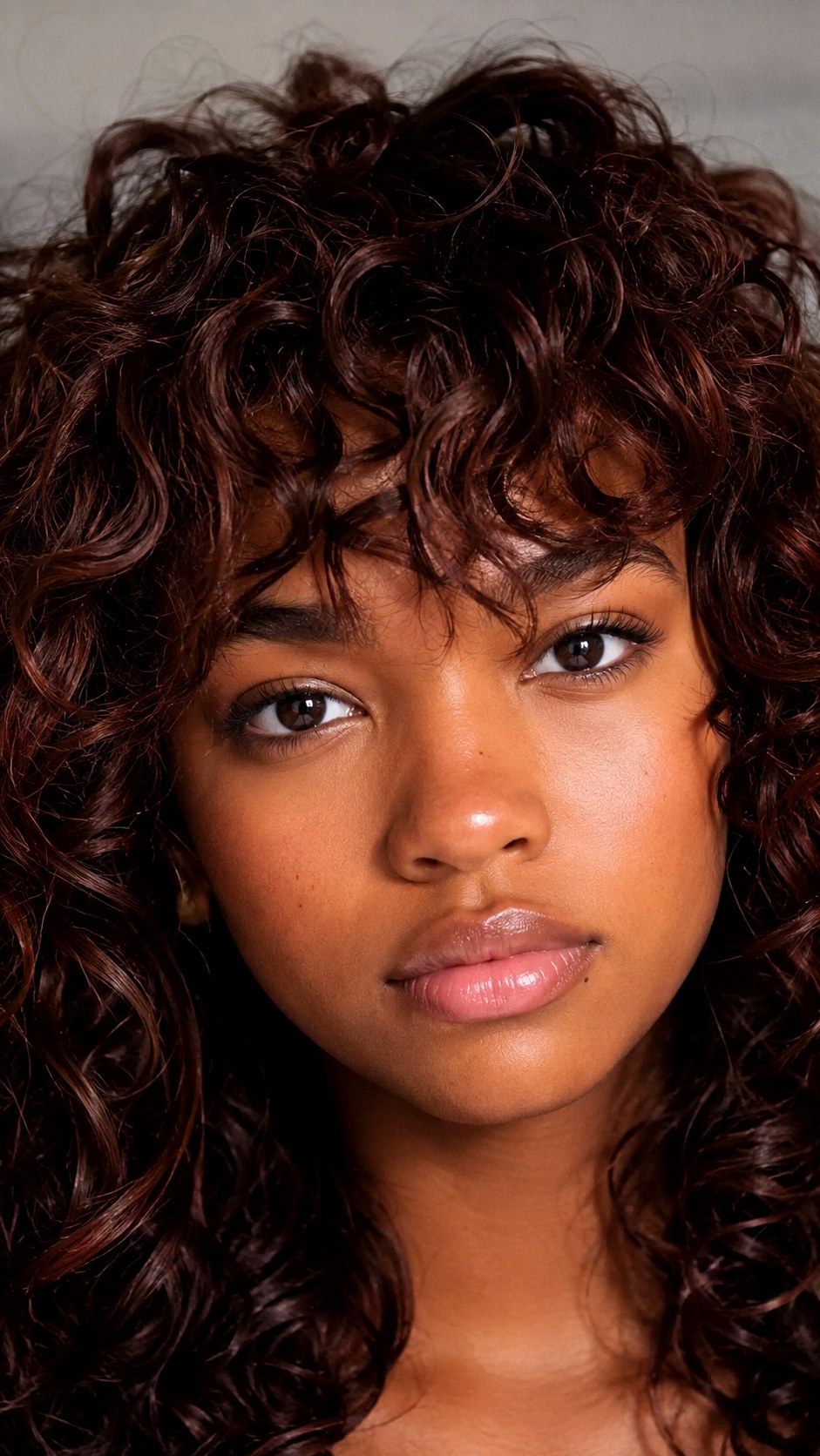 Mahogany Mocha on a Curly Shag - 23 hair color for brown skin ideas