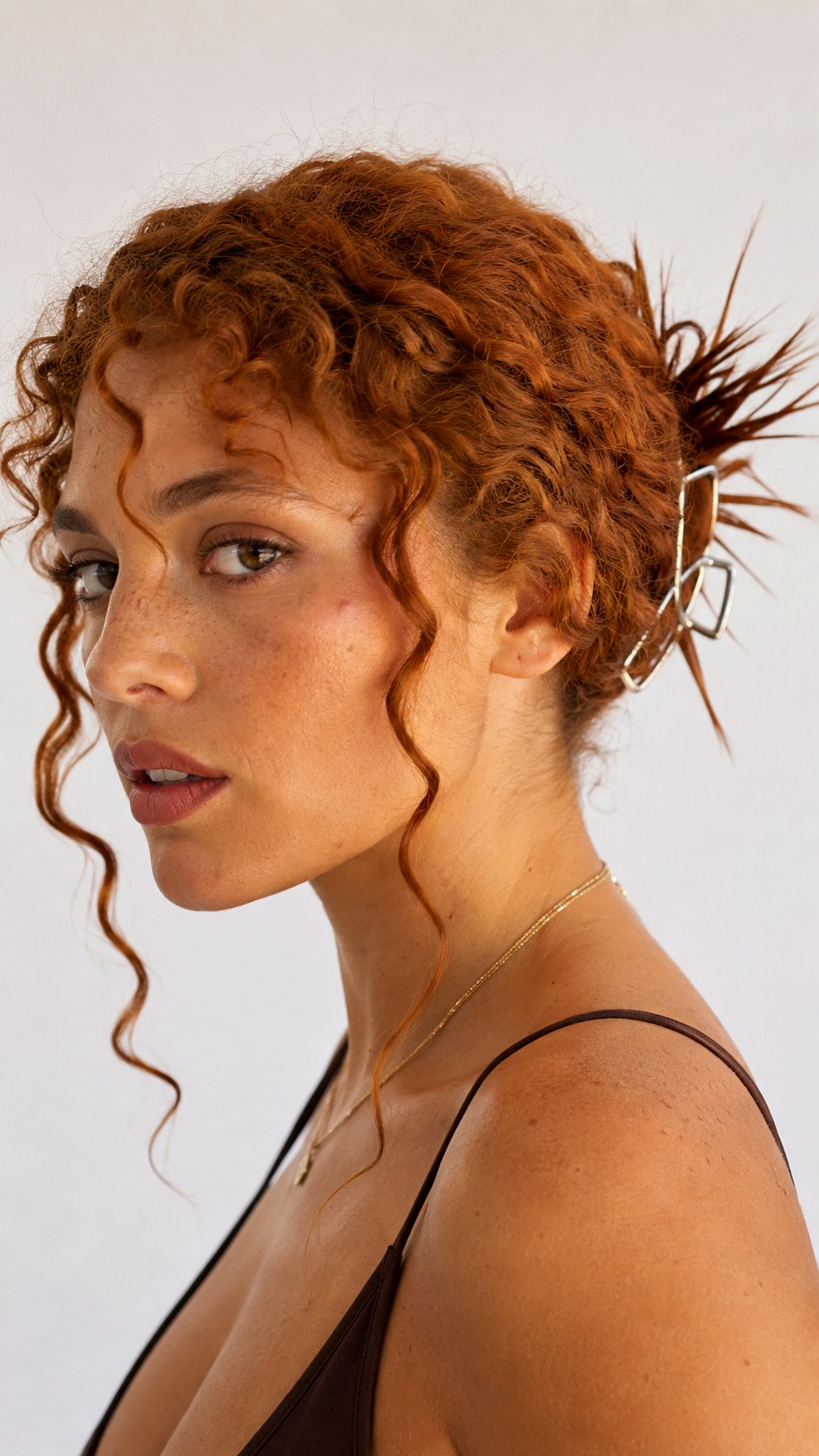 Spiky Low Chignon With Tendrils - 21 spiky claw hairstyle ideas